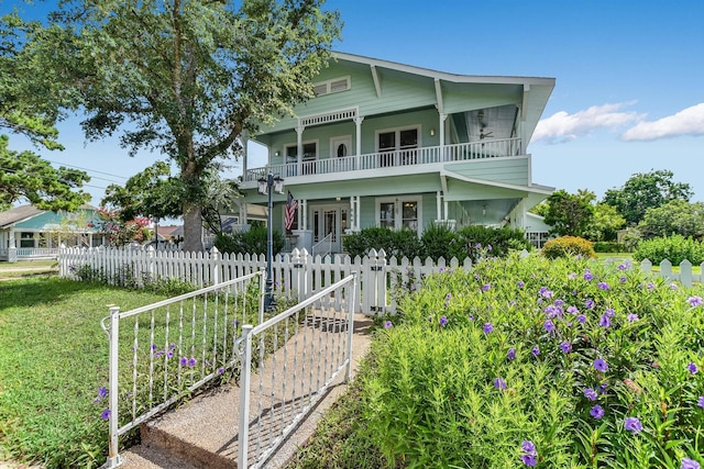 864 N Franklin St, La Grange, TX 78945 - view of front of house with a gate, french doors, and a balcony