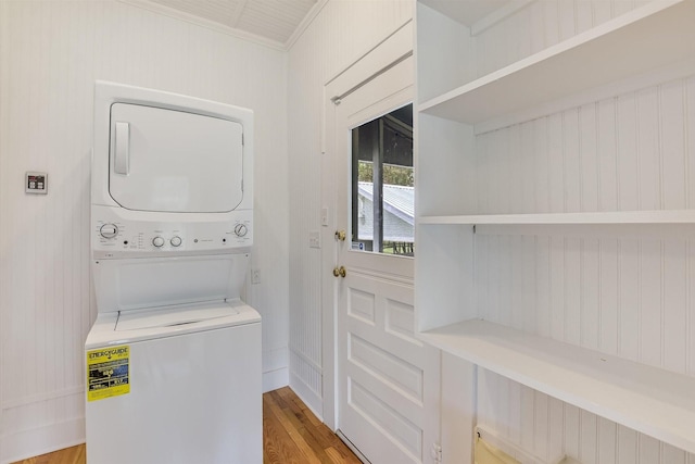 864 N Franklin St, La Grange, TX 78945 - washroom featuring stacked washing machine and dryer and light wood-style flooring