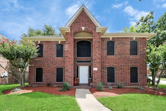 1503 Pine Ridge Ln, Pearland, TX 77581 - view of front of property featuring brick siding and a front yard