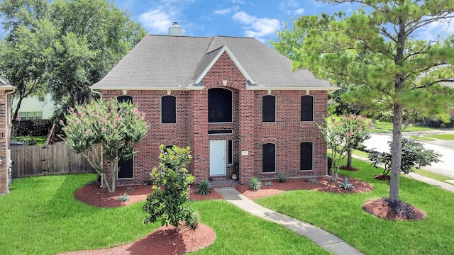 1503 Pine Ridge Ln, Pearland, TX 77581 - view of front of property with a chimney, brick siding, and roof with shingles