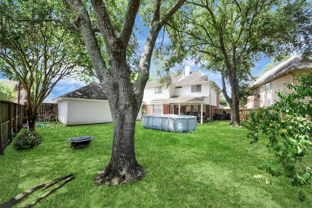 1503 Pine Ridge Ln, Pearland, TX 77581 - fenced backyard with an outdoor pool