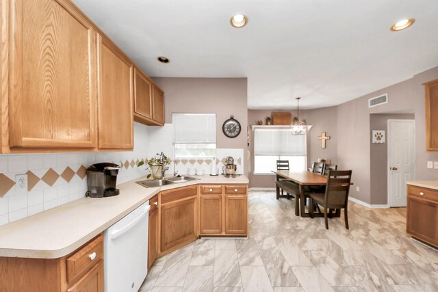 1503 Pine Ridge Ln, Pearland, TX 77581 - kitchen featuring dishwasher, light countertops, backsplash, recessed lighting, and hanging light fixtures