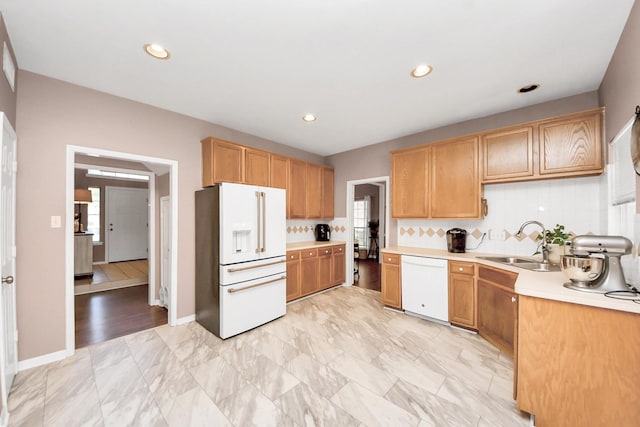 1503 Pine Ridge Ln, Pearland, TX 77581 - kitchen featuring white appliances, light countertops, tasteful backsplash, and recessed lighting