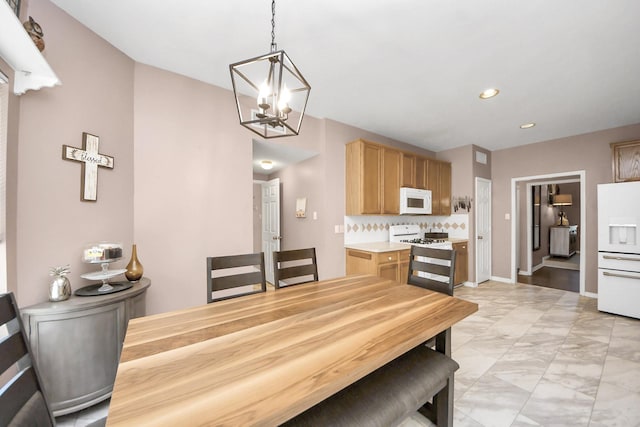 1503 Pine Ridge Ln, Pearland, TX 77581 - dining space with a chandelier, recessed lighting, and light marble finish floors