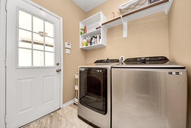 1503 Pine Ridge Ln, Pearland, TX 77581 - laundry area with washing machine and dryer and baseboards