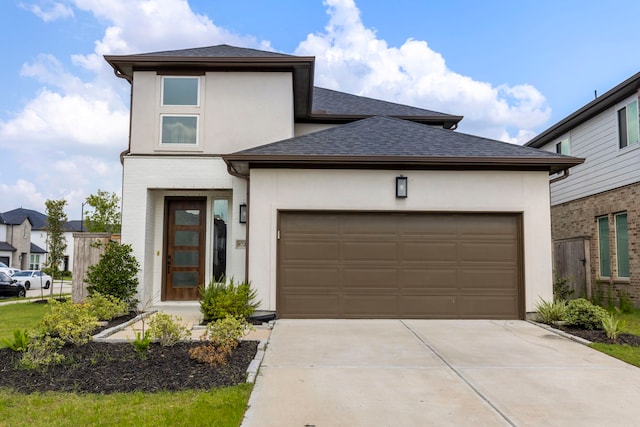 8722 Riverton Ridge Rd, Cypress, TX 77433 - prairie-style home featuring stucco siding, concrete driveway, a garage, and a shingled roof