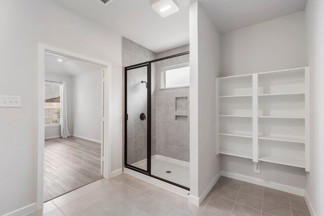 8722 Riverton Ridge Rd, Cypress, TX 77433 - full bathroom with a stall shower, healthy amount of natural light, and tile patterned flooring