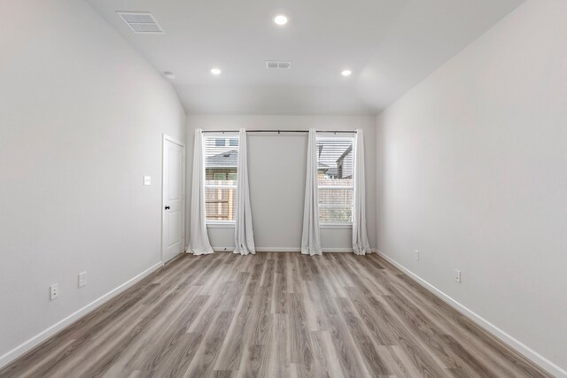 8722 Riverton Ridge Rd, Cypress, TX 77433 - spare room with light wood-type flooring and recessed lighting