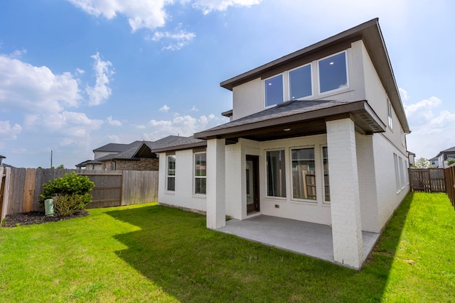 8722 Riverton Ridge Rd, Cypress, TX 77433 - rear view of property featuring brick siding, a patio, a fenced backyard, and roof with shingles
