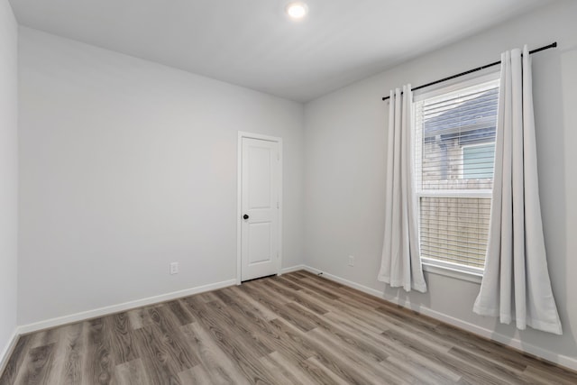 8722 Riverton Ridge Rd, Cypress, TX 77433 - unfurnished room with wood finished floors and recessed lighting