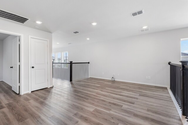 8722 Riverton Ridge Rd, Cypress, TX 77433 - empty room featuring light wood finished floors and recessed lighting