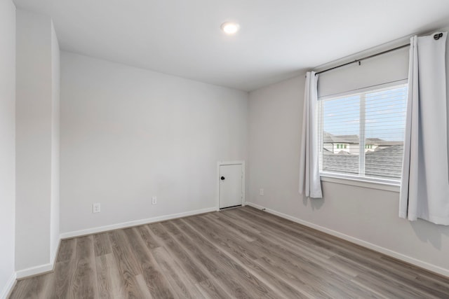 8722 Riverton Ridge Rd, Cypress, TX 77433 - unfurnished room featuring wood finished floors and recessed lighting
