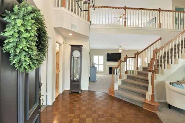12911 Bristol Berry Dr, Cypress, TX 77429 - entryway with stairs, a ceiling fan, and a towering ceiling