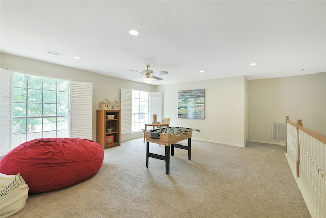 12911 Bristol Berry Dr, Cypress, TX 77429 - recreation room with healthy amount of natural light, ceiling fan, light carpet, and recessed lighting