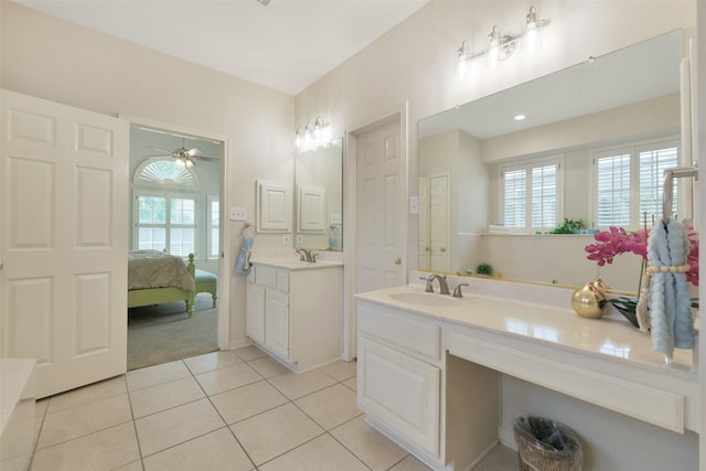 12911 Bristol Berry Dr, Cypress, TX 77429 - bathroom with plenty of natural light, two vanities, tile patterned floors, and a ceiling fan
