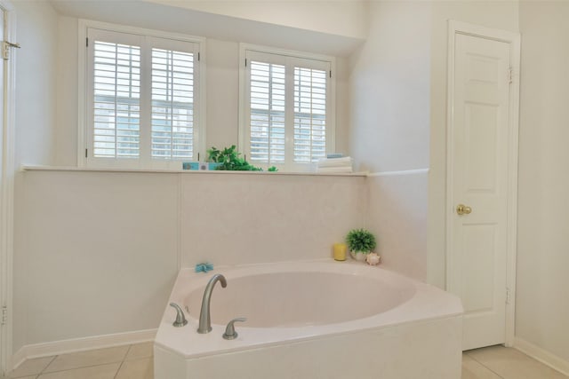 12911 Bristol Berry Dr, Cypress, TX 77429 - bathroom featuring tile patterned flooring, a bath, and healthy amount of natural light