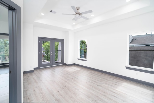 4417 Aledo St, Houston, TX 77051 - unfurnished room featuring wood finished floors, plenty of natural light, a tray ceiling, recessed lighting, and a ceiling fan