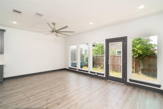 4417 Aledo St, Houston, TX 77051 - spare room featuring light wood-type flooring, healthy amount of natural light, a ceiling fan, and recessed lighting