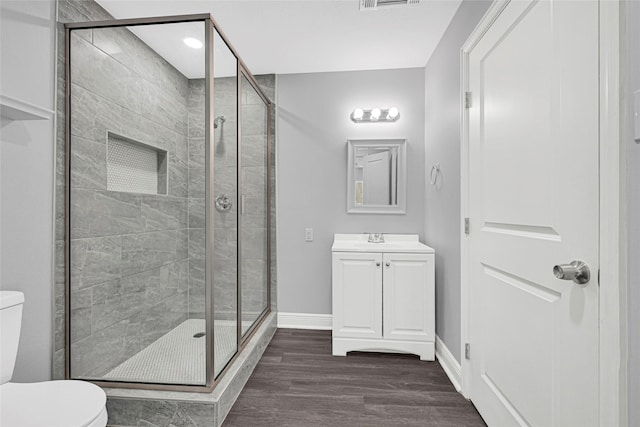 639 Ames St, Spring, TX 77373 - full bathroom with a stall shower, vanity, and wood finished floors