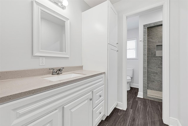 639 Ames St, Spring, TX 77373 - bathroom with a stall shower, vanity, and wood finished floors