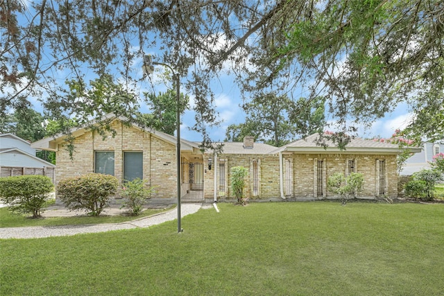 639 Ames St, Spring, TX 77373 - single story home featuring a front yard, a chimney, and brick siding