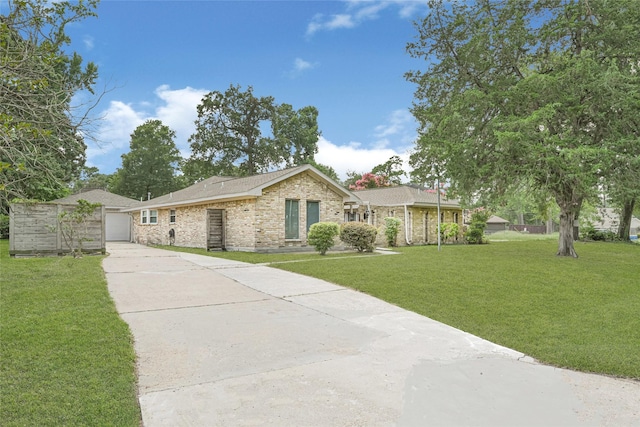 639 Ames St, Spring, TX 77373 - single story home featuring concrete driveway, a front yard, a garage, brick siding, and a shingled roof