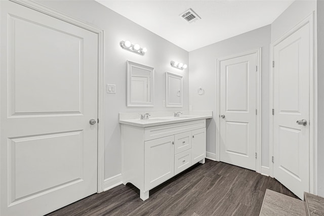 639 Ames St, Spring, TX 77373 - full bathroom featuring wood finished floors and double vanity