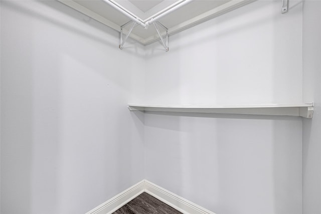 639 Ames St, Spring, TX 77373 - walk in closet featuring dark wood finished floors