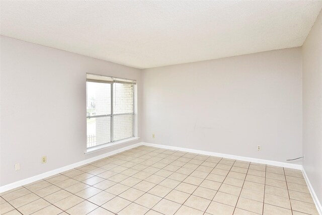 1950 Spenwick Dr Unit 408, Houston, TX 77055 - empty room featuring baseboards and light tile patterned flooring