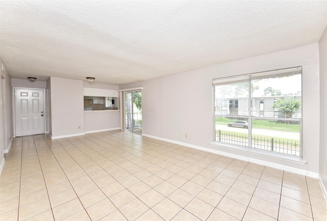 1950 Spenwick Dr Unit 408, Houston, TX 77055 - unfurnished living room with baseboards and a textured ceiling