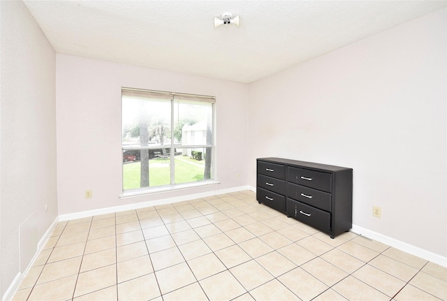 1950 Spenwick Dr Unit 408, Houston, TX 77055 - empty room with baseboards and light tile patterned floors