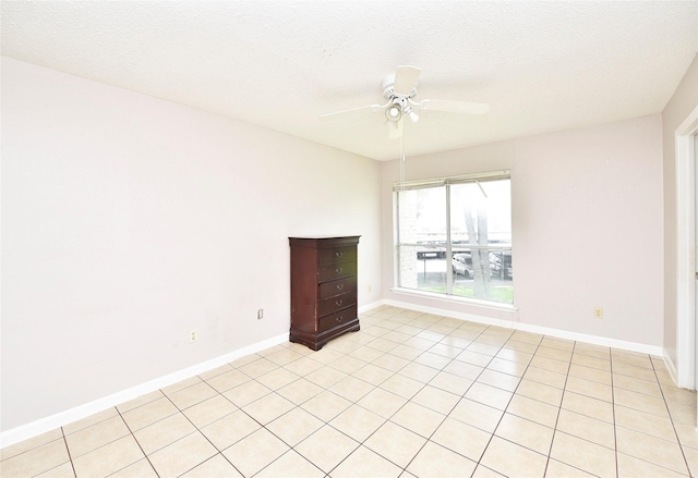 1950 Spenwick Dr Unit 408, Houston, TX 77055 - empty room featuring ceiling fan, light tile patterned floors, and a textured ceiling
