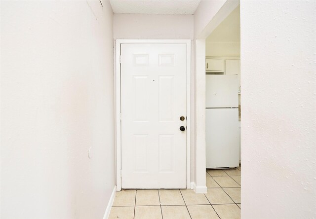 1950 Spenwick Dr Unit 408, Houston, TX 77055 - hall featuring light tile patterned floors