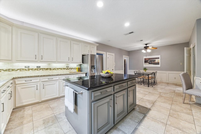 6019 Oak Creek Ln, Spring, TX 77379 - kitchen featuring stainless steel fridge, a ceiling fan, gray cabinets, tasteful backsplash, and recessed lighting