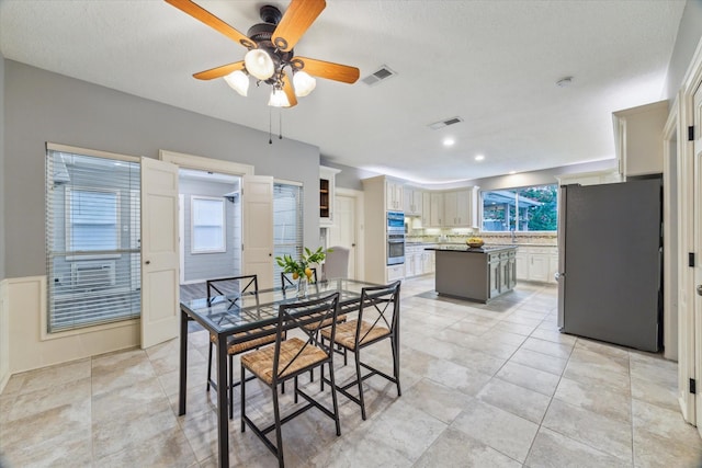 6019 Oak Creek Ln, Spring, TX 77379 - dining room with ceiling fan, recessed lighting, and light tile patterned floors