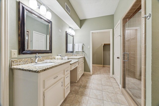 6019 Oak Creek Ln, Spring, TX 77379 - bathroom featuring double vanity, a stall shower, and tile patterned flooring