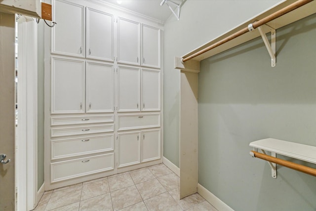6019 Oak Creek Ln, Spring, TX 77379 - walk in closet featuring light tile patterned floors