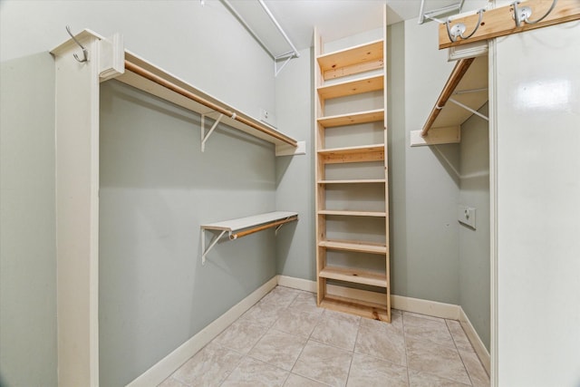 6019 Oak Creek Ln, Spring, TX 77379 - spacious closet featuring light tile patterned flooring