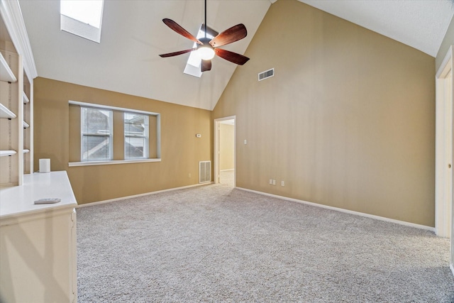 6019 Oak Creek Ln, Spring, TX 77379 - empty room featuring high vaulted ceiling, ceiling fan, carpet floors, and a skylight