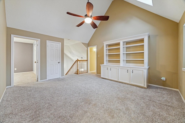 6019 Oak Creek Ln, Spring, TX 77379 - spare room featuring a ceiling fan, carpet floors, a skylight, and high vaulted ceiling