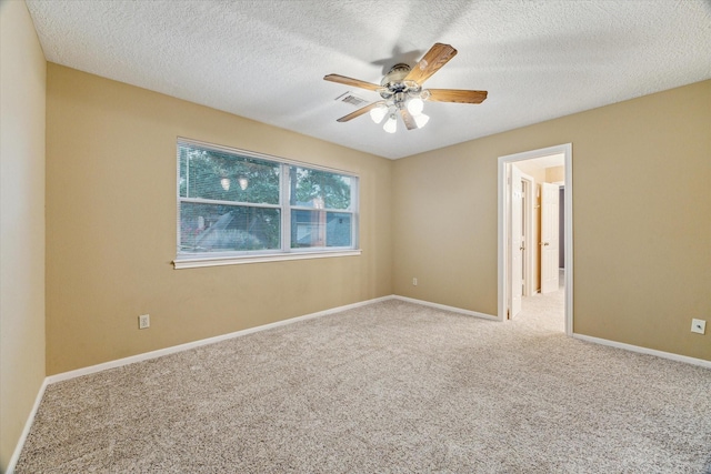 6019 Oak Creek Ln, Spring, TX 77379 - empty room featuring a ceiling fan, carpet, and a textured ceiling