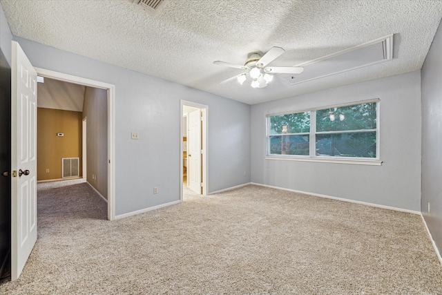 6019 Oak Creek Ln, Spring, TX 77379 - unfurnished room featuring ceiling fan, attic access, a textured ceiling, and carpet flooring