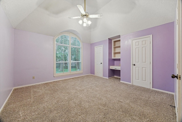 6019 Oak Creek Ln, Spring, TX 77379 - unfurnished bedroom featuring vaulted ceiling, carpet flooring, a textured ceiling, and ceiling fan