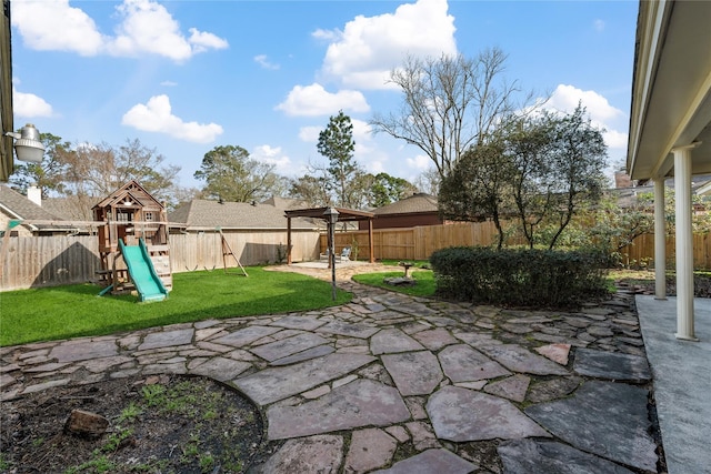 19702 Sweet Forest Ln, Humble, TX 77346 - fenced backyard featuring a playground and a patio area