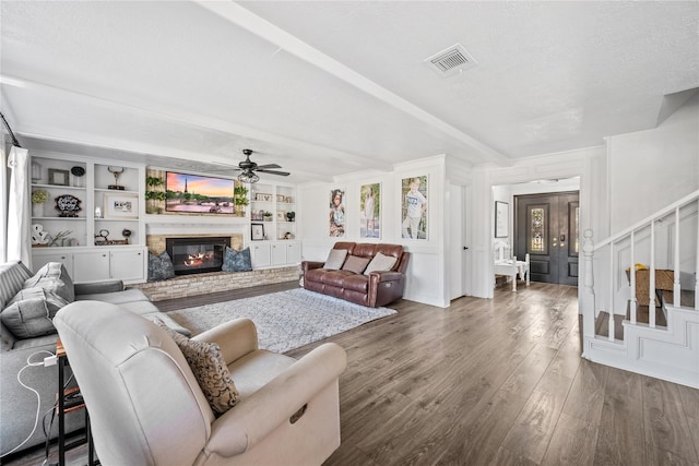 19702 Sweet Forest Ln, Humble, TX 77346 - living room with a ceiling fan, wood finished floors, a fireplace, and stairway