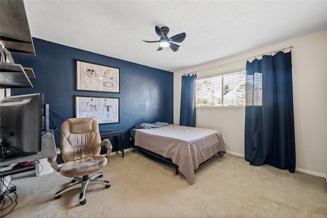 19702 Sweet Forest Ln, Humble, TX 77346 - bedroom with carpet, a textured ceiling, and a ceiling fan
