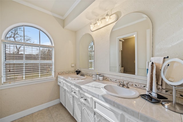 19702 Sweet Forest Ln, Humble, TX 77346 - full bath with double vanity, ornamental molding, tile patterned flooring, and a textured wall