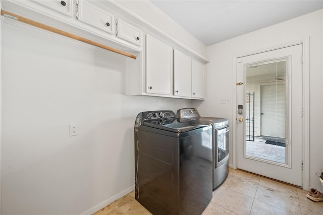 19702 Sweet Forest Ln, Humble, TX 77346 - laundry room with independent washer and dryer, cabinet space, and light tile patterned floors