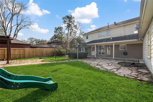 19702 Sweet Forest Ln, Humble, TX 77346 - view of yard featuring a patio area and a playground