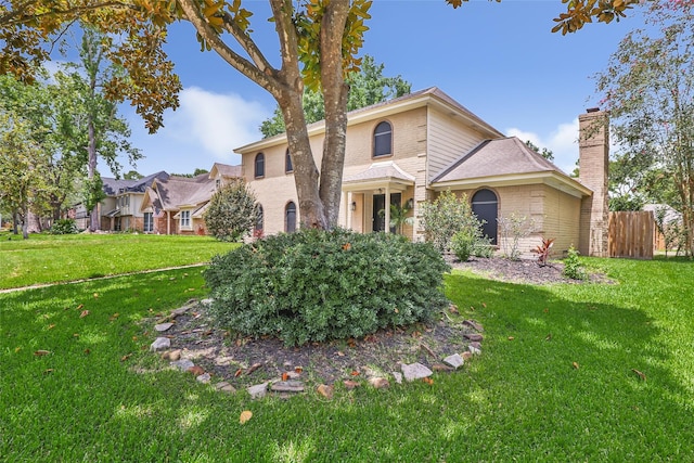 19702 Sweet Forest Ln, Humble, TX 77346 - traditional home with a chimney and brick siding